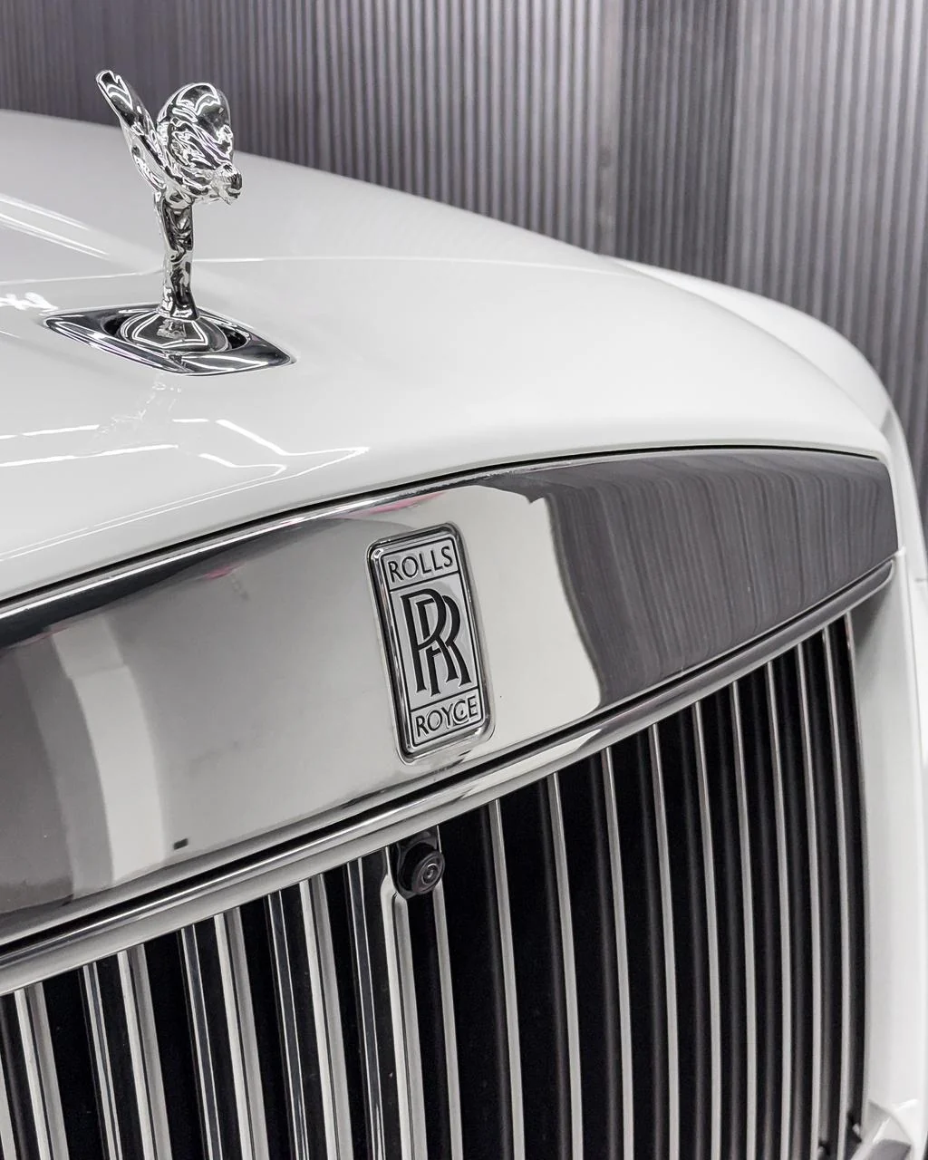 Paint protection film application on a luxury car